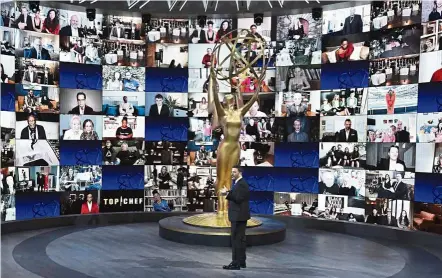  ?? — AFP ?? First of its kind: Kimmel speaking in front of a wall of nominees watching remotely at the Staples Center during the 72nd Primetime Emmy Awards ceremony.
