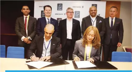  ??  ?? BARCELONA: Bader Al Kharafi, Zain Vice-Chairman & Group CEO and Rafiah Ibrahim, Head of Ericsson MEA sign an agreement flanked by Zain and Ericsson executives.