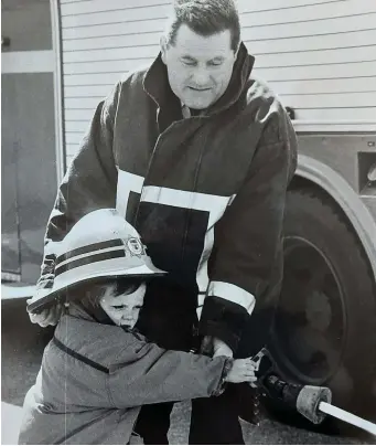  ??  ?? Aspiring fireman Dermot Lucid, Ballyheigu­e, learns a little about controllin­g a firehose from with help from Station Officer John Mason.