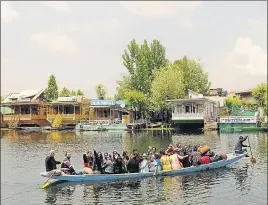  ?? WASEEM ANDRABI/HT ?? Tourists take a boatride on Dal Lake in Srinagar on Tuesday.