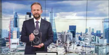  ??  ?? Daher with the ‘Best Private Bank’ award from Global Banking &amp; Finance Review, which IBQ won in London recently.