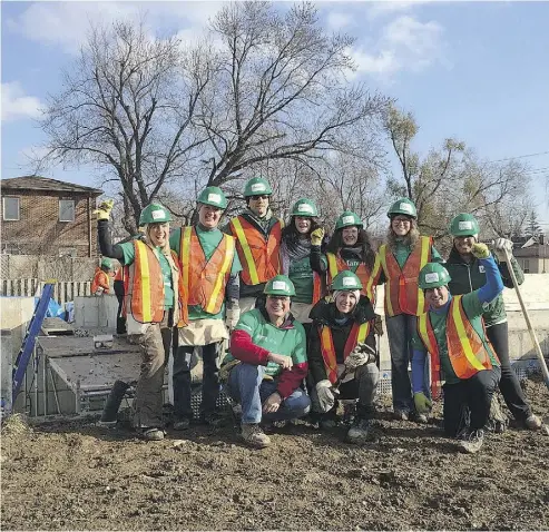  ?? PHOTOGRAPH COURTESY OF MANULIFE ?? As part of Manulife’s volunteer efforts, employees helped build a house for Habitat for Humanity Nov. 24, 2015,
in the Greater Toronto Area.