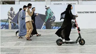  ?? /Reuters ?? Green zone: People walk and ride in the green zone at the UN Climate Change Conference (COP28) in Dubai, United Arab Emirates, in December.