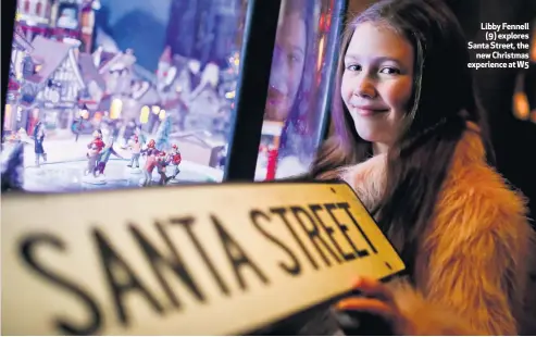  ??  ?? Libby Fennell
(9) explores Santa Street, the
new Christmas experience at W5