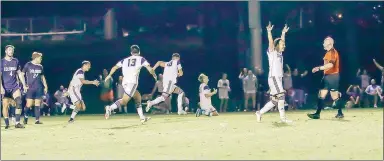  ?? Photo courtesy of JBU Sports Informatio­n ?? John Brown men’s soccer players celebrate after scoring a goal Tuesday, Sept. 20 against Columbia (Mo.).