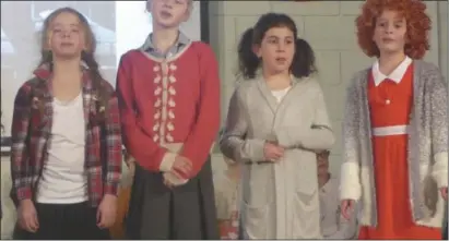  ??  ?? North Cheshire Jewish Primary pupils on song in the school show, “A Tale of Two Orphans”, based on musicals Annie and Oliver. From left: Sophie Van Dellen, Rafaella Ingleby-Castleton, Talia Redshaw and Ruby Moryoussef