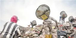  ?? ADAM DEAN/THE NEW YORK TIMES ?? Trash pickers search for plastic in Indonesia. Data show the U.S. continues to ship plastic scrap overseas because it didn’t join in a global ban.