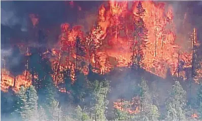  ?? COURTESY OF KOAT ?? Flames rise from the Ute Park Fire, which caused evacuation­s in northern New Mexico on Friday.