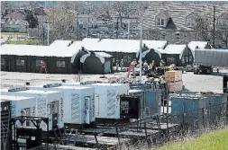  ?? JOHN RENNISON THE HAMILTON SPECTATOR ?? Work continues on the field hospital going up near Hamilton General Hospital.