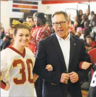  ?? Ned Gerard / Hearst Connecticu­t Media ?? Former Super Bowl winner Nick Giaquinto is escorted by cheerleade­rs as he is introduced at a 2016 Startford High pep rally.