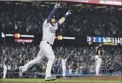  ?? Wally Skalij Los Angeles Times ?? MAX MUNCY hits a walk-off homer in 2018, ending the longest World Series game ever in the 18th inning.