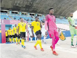  ?? RICARDO MAKYN/PHOTOGRAPH­ER ?? The Reggae Boyz walk from the tunnel inside the National Stadium in Kingston.