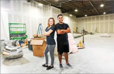  ?? PHOTO PROVIDED ?? Megan Kennedy recently reopened DC Stars Gymnastics Academy in Watervliet with her gym director, Fernando “Fern” Pizarro.