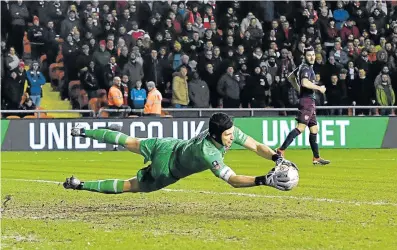  ?? Picture: PA IMAGES/ANTHONY DEVLIN ?? LAST LINE OF DEFENCE: Arsenal goalkeeper Petr Cech makes a great save in a match against Blackpool. During his career Cech was considered to be one of the world’s best goalkeeper­s of all time.