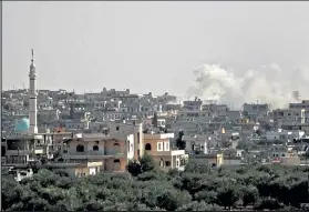  ?? Omar HAJ kadour / AFP ?? Smoke rises Tuesday from Syrian government forces’ bombardmen­t on the village of al-bara, in the southern part of the rebel-held northweste­rn province of Idlib.