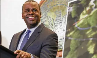  ?? ALYSSA POINTER / AJC ?? Atlanta Mayor Kasim Reed jokes during his final press conference Friday as mayor at Atlanta City Hall. Reed also celebrated with food and a live DJ in the auditorium of the building.