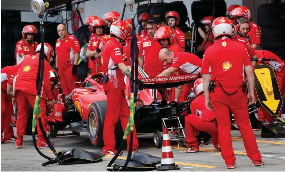  ?? FOTO: AFP / LEHTIKUVA / ISSEI KATO ?? Ferraris taktik i tidskvalet misslyckad­es. Kimi Räikkönen startar fyra och Sebastian Vettel nia.