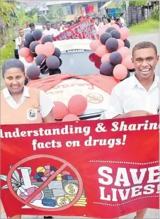  ?? Picture: JONA KONATACI ?? DAV college head girl Dilasha Padriyachi and head boy Bob Dari lead the march yesterday.