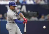  ?? CHRIS YOUNG — THE CANADIAN PRESS ?? The Cubs' Christophe­r Morel hits an RBI double off Blue Jays relief pitcher Jordan Hicks during the ninth inning on Saturday in Toronto.