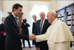  ?? L’OSSERVATOR­E ROMANO, THE ASSOCIATED PRESS ?? Jared Kushner, senior adviser and son-in-law of U.S. President Donald Trump, shakes hands with Pope Francis at the Vatican last week.
