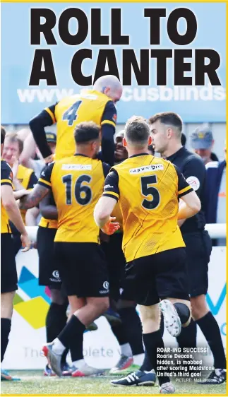  ?? PICTURE: Matt Bristow ?? ROAR-ING SUCCESS! Roarie Deacon, hidden, is mobbed after scoring Maidstone United’s third goal