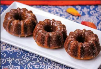  ?? Food styling/KELLY BRANT Arkansas Democrat-Gazette/BENJAMIN KRAIN ?? Mini Pumpkin Bundt Cakes With Brown Butter-Bourbon Glaze