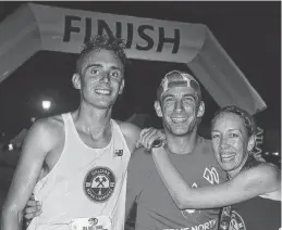  ?? BRAE SHEA/JOURNAL PIONEER ?? First-place winner Will Bryden poses for a photo with PaceBunny Michael Lucien-Bergeron and second-place runner Erin Poirier after the Run Under the Stars over the weekend.