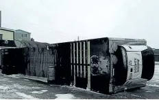  ?? TERRY OSMOND HANDOUT/ THE CANADIAN PRESS ?? A trailer turned over on its side is shown in this photo after high winds in Port- aux- Basque, N. L., on Monday.