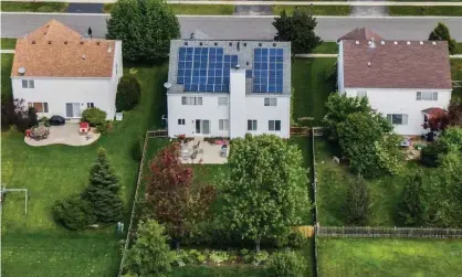  ?? Photograph: Tannen Maury/EPA ?? An aerial photo taken with a drone shows solar panels installed on a private home in Round Lake Heights, Illinois.