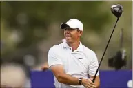  ?? Martin Dokoupil / Associated Press ?? Rory McIlroy watches the ball after teeing off at the 18th hole during DP World Tour Championsh­ip in Dubai, United Arab Emirates, on Sunday.