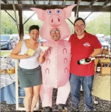  ?? Ledyard Farmers Market / Contribute­d photo ?? East Haddam Staehly Farm Winery owner Kevin Staehly, right, poses for a photograph at the Ledyard Farmers Market.