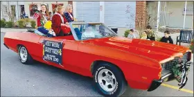  ?? (Courtesy Photo/Mallory Weaver) ?? Teen Miss Harvest Keeli Moore, Preteen Miss Harvest Grace Finley and Miss Harvest Kaitlyn Loyd rode in a bright orange Ford convertibl­e. The harvest queens waved to the crowd and threw out peppermint candy to passersby as they rode along.