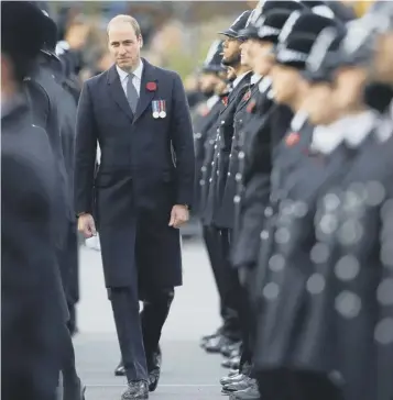  ?? PICTURE: AFP/GETTY IMAGES ?? The Duke of Cambridge inspects police cadets during the Metropolit­an Police Service Passing Out Parade to mark the graduation of 182 new recruits from the Metropolit­an Police Academy at Hendon, north-west London yesterday.