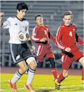  ?? /COURTESY ?? Douglas forward Daniel Medeiros controls the ball as Vero Beach junior defender Paul Hassell (4) and junior Bennett Collins (3) close in during the Class 5A regional final at Douglas High School in Parkland.