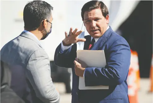  ?? JOE RA EDLE / GETTY IMAGES FILES ?? Florida Gov. Ron Desantis leaves after holding a press conference last week about the opening
of a COVID-19 vaccinatio­n site at the Hard Rock Stadium in Miami Gardens.