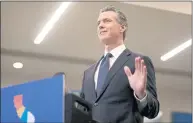  ?? ARIC CRABB STAFF PHOTOGRAPH­ER ?? Gov. Gavin Newsom takes part in a news conference at a Kaiser Permanente medical clinic on July 26 in Oakland. Newsom said Friday he has no immediate plans to require teachers to mandate vaccines for teachers, unlike health care workers.