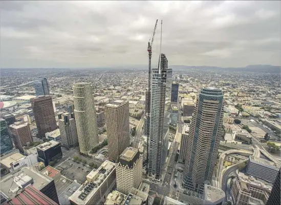  ?? Irfan Khan Los Angeles Times ?? AFTER YEARS of negotiatio­ns, the Wilshire Grand’s architects won concession­s from city officials so they could create a vertical ornament for the building’s roof.