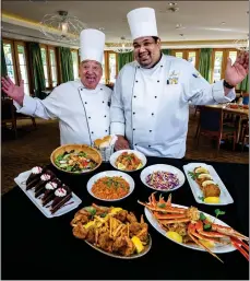  ?? ?? Fantasy Springs Resort Casino Executive Chef Freddy Rieger, left, and POM Chef A.J. Atkins create a menu for The POM restaurant’s seafood night.