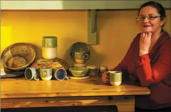  ?? Delia O’Donoghue with a selection of her work from the Knocknagos­hel-based Delia O’Donoghue Ceramics workshop. Photo by John Reidy. ??