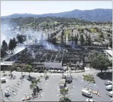  ?? AP PHOTO/NHAT V. MEYER ?? Smoke rises from an extinguish­ed fire at the Home Depot off Blossom Hill Road in San Jose, Calif., on April 10.