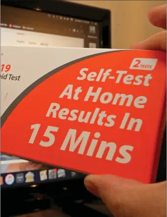  ?? STUART CAHILL/HERALD STAFF ?? STOCKING UP: The Biden administra­tion has announced that households are able to receive a third round of free rapid COVID tests directly to their doorstep.