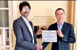  ??  ?? Vietnam Blockchain Corporatio­n CEO Do Van Long receives Global Academy of Finance and Management’s ‘Master Fintech Profession­al’ Certificat­ion from Fintech Associatio­n of Sri Lanka President and GAFM Representa­tive in Sri Lanka and the Maldives Rajkumar Kanagasing­am, at Park Hyatt Saigon, Vietnam