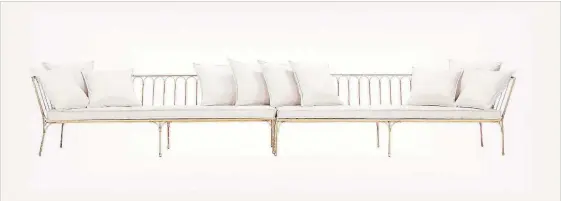  ?? CB2 VIA AP ?? A gold iron frame and upholstere­d cushions give this La Reve sectional a luxe look.