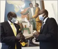  ?? (AFP) ?? South Sudanese presidenti­al representa­tive Barnaba Marial Benjamin (left) and Thomas Cirillo Swaka, member of the South Sudan Opposition Alliance, at the end of a meeting in the Community of Sant’Egidio’s Internatio­nal Relations headquarte­r in Rome on Wednesday.