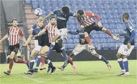  ??  ?? Josh Scowen scores Sunderland’s winning goal at Boundary Park.