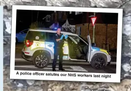  ??  ?? A police officer salutes our NHS workers last night