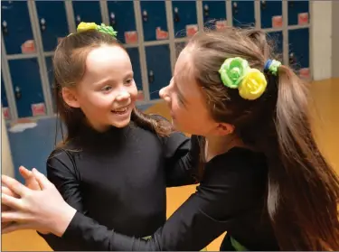  ??  ?? Hannah Ní Dhubháin and Sadhbh Madeley getting in a quick rehearsal before going on stage at the West Kerry final of Scór na bPáistí in Pobalscoil Chorca Dhuibhne on Friday night.