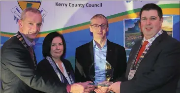  ?? All photos by Valerie O’Sullivan ?? Cathaoirle­ach Kerry County Council Cllr Niall Kelleher presenting Kevin Lynch with his award in recognitio­n of his achievemen­t at European Masters Athletics. Also included is Chief Executive Kerry County Council Moira Murrell and Cllr Michael Kennelly, Listowel.