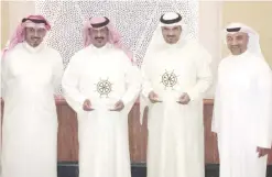  ??  ?? KUWAIT: Kuwait Oil Tanker Company (KOTC) representa­tives receive the award for being the best operator in tankers offshore. — KUNA