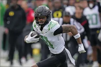  ?? RICK BOWMER — THE ASSOCIATED PRESS ?? Oregon wide receiver Troy Franklin (11) carries the ball during the first half of an NCAA college football game against Utah Saturday, Oct. 28, 2023, in Salt Lake City.